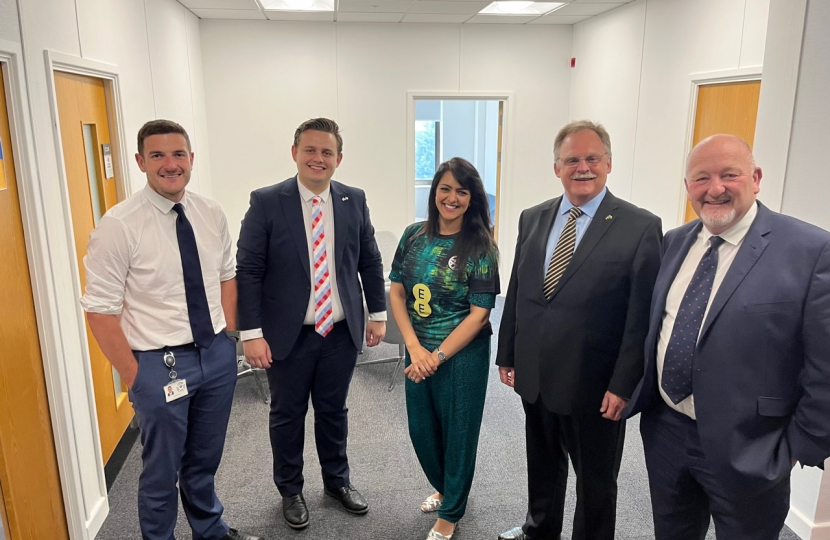 Natasha Asghar wearing her Hope United shirt alongside Peter Fox MS, Mark Isherwood MS, Tom Giffard MS and James Evans MS.