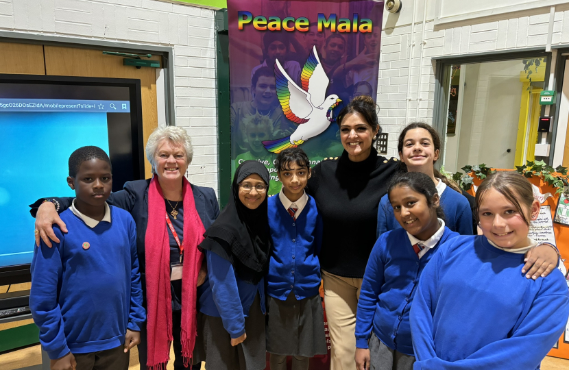 Natasha Asghar MS with Pam Evans MBE and pupils at Maindee Primary School.