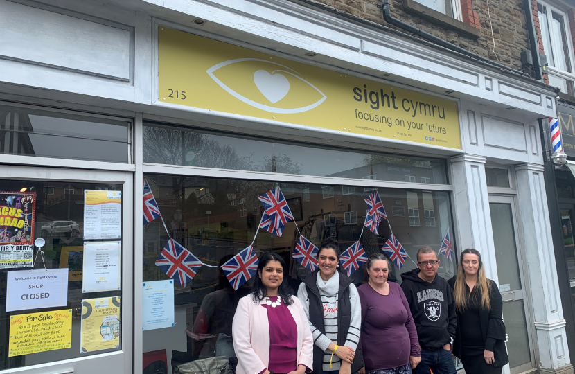 Natasha Asghar MS outside Sight Cymru's first charity shop.