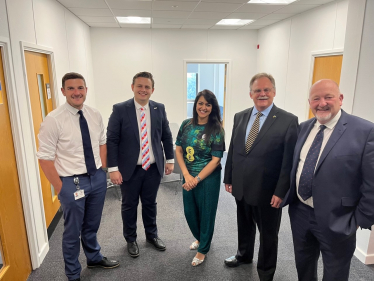 Natasha Asghar wearing her Hope United shirt alongside Peter Fox MS, Mark Isherwood MS, Tom Giffard MS and James Evans MS.