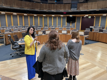 Natasha Asghar MS giving students a tour of the Senedd chamber.