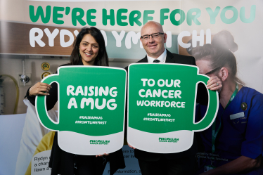 Natasha Asghar MS raising a mug at Macmillan’s coffee morning in the Senedd this week.